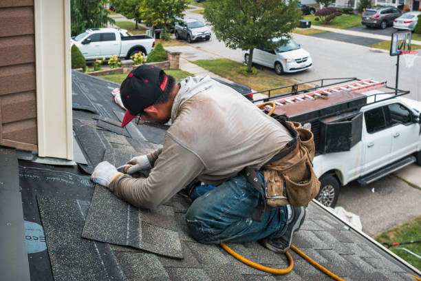 Professional Roofing technician working in Marengo, IA